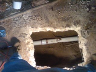Clipped out slab to access drain pipe